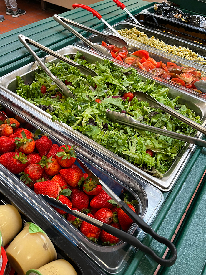 Freshly cooked broccoli and strawberries