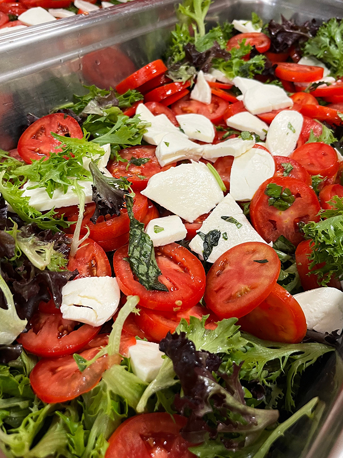 Beautiful green salad with tomatoes cheese