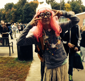 staff member dressed up with pink hair and glasses